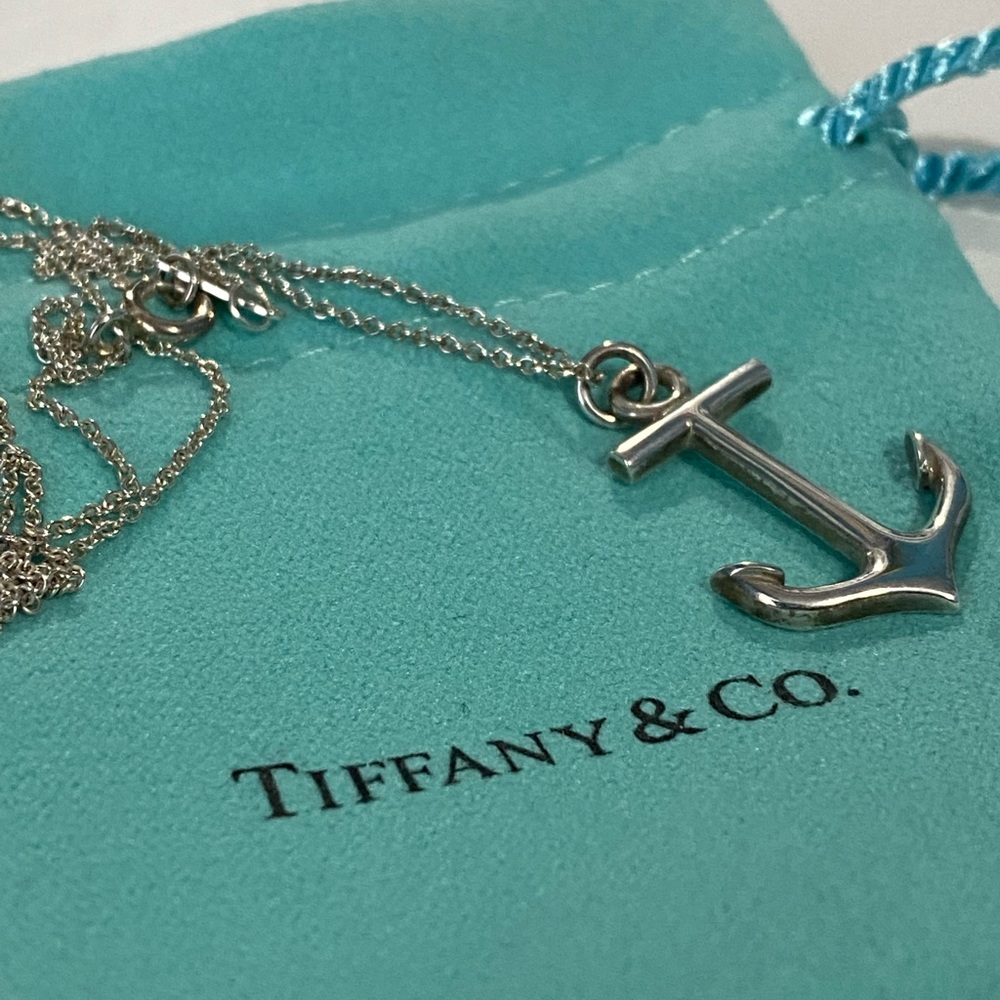 Tiffany and Co sterling silver anchor pendant on 16” chain with pouch